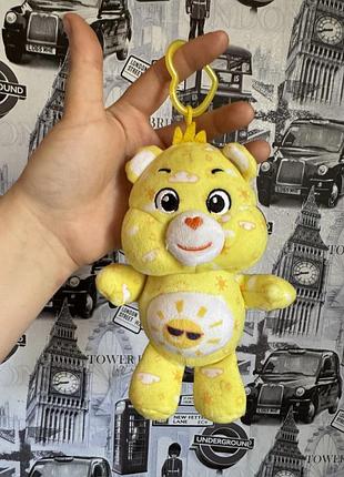 Мягкую игрушку-брелок funshine bear (мишка солнышка) из серии care bears (бадливые мишки...