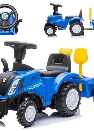 Іграшковий трактор new holland з причепом гудзиком мелодіями на перший рік життя