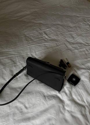 Hermes kelly pochette black/gold 2