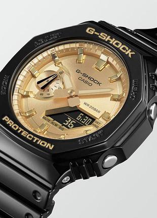 Чоловічий годинник casio g-shock ga-2100gb-1a з водозахистом 20 atm та золотистим циферблатом 2