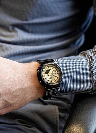 Чоловічий годинник casio g-shock ga-2100gb-1a з водозахистом 20 atm та золотистим циферблатом 7