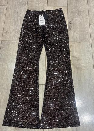 Штани кльош в паєтки zara. нові з бірками!