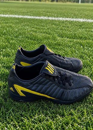 Футбольні сороконіжки adidas f50 trx turf чорні з жовтими елементами