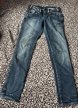 Levi’s жіночі джинси на низький талії сині з карманами на блискавці з ефектом потертості