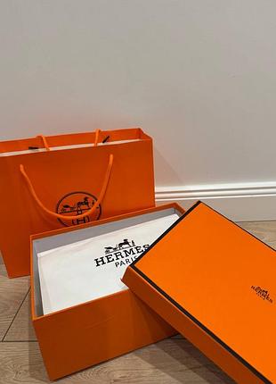 Пакування hermès: оранжева фірмова коробка, пакет та стрічка пильовик ермес