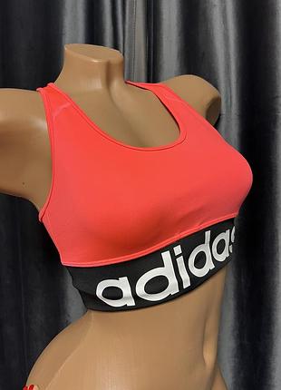 Спортивний топ-бра adidas коралово-рожевого кольору