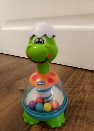 Розвивальна іграшка для малюків chicco дзига діно різнокольорова