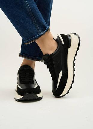Черные кожаные кроссовки lonza shoes с контрастной белой отделкой по контуру.