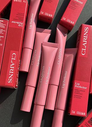 Блиск для губ clarins instant natural light lip perfector.