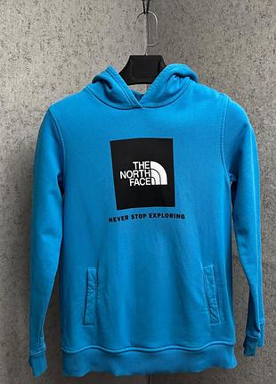 Блакитна кофта з капюшоном від бренду the north face