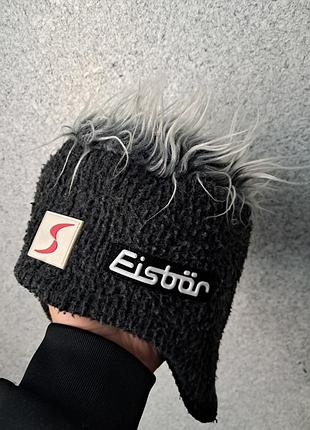 Зимова шапка темно-сірого кольору з довгим декоративним волоссям eisbär