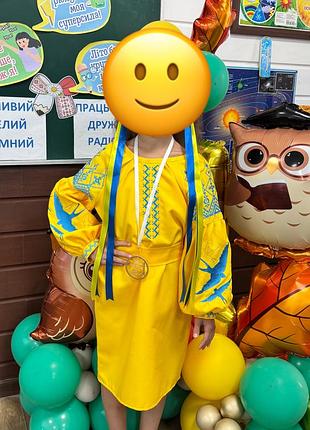 Вишиванка для дівчинки жовта з синьо-зеленим орнаментом, розмір 134