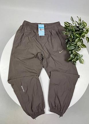 Нейлоновые брюки nike notta черные