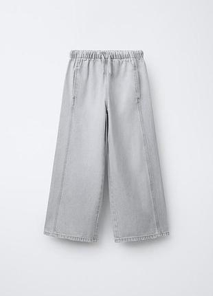 Широкие для девочки джинсы zara kids  для подростка светло-серого цвета.