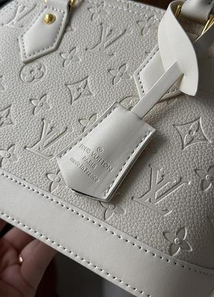 Сумка alma monogram louis empreinte vuitton leather cream 6