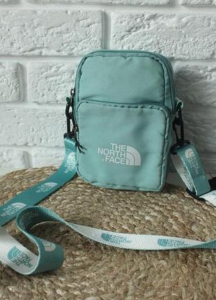 Бірюзова сумка через плече the north face