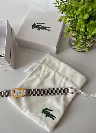 Чоловічий браслет lacoste — сріблястий із золотим елементом, нержавіюча сталь, плетений дизайн