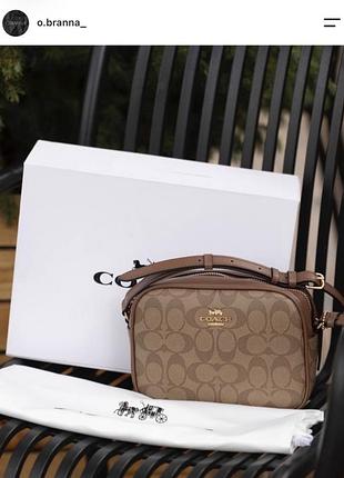 Жіноча сумка coach через плече коричнева