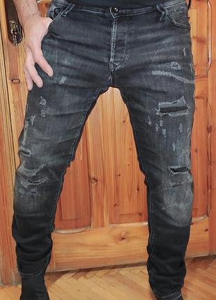Нові сток чоловічі чорні завужені джинси бренду jack & jones (модель slim / glenn із потертостями та декоративними розривами.34-32.