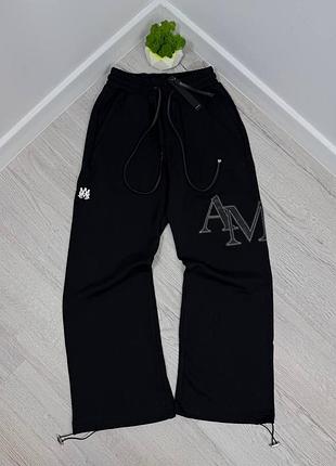 Штани від бренду amiri