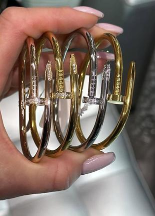 Гіпоалергенний позолочений браслет цвях з лого з медичної сталі (stainless steel)