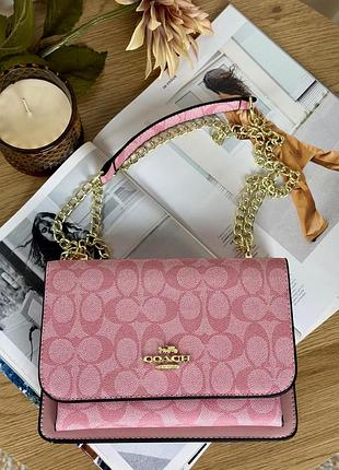 Сумка coach klare crossbody bag in signature canvas розовый