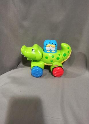 Інерційна іграшка каталка крокодил fisher-price amazing animals press & go crocodile,