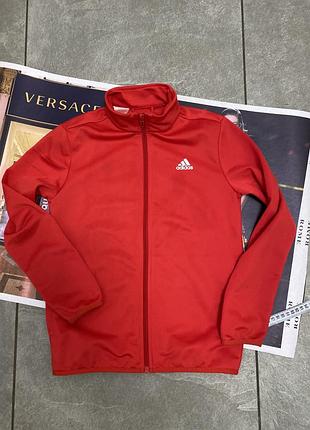 Червона спортивна олімпійка бренду adidas із білим логотипом на грудях та високим коміром-стійкою на блискавці