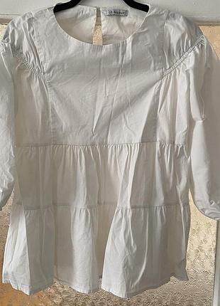 Белая хлопковая блузка от бренда nualy