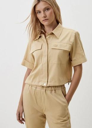 Сорочка жіноча lacoste бежева коротка з коротким рукавом та накладними кишенями