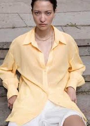Зображена представлена ​​жіноча лляна сорочка від бренду h&m ,у світло-жовтому/бежевому відтінку.