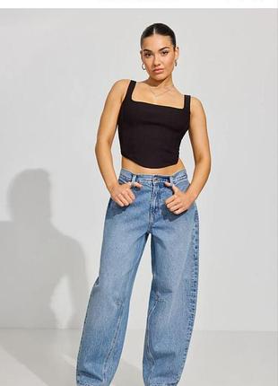 Світло-блакитні джинси  baggy  від garage denim з витачками на колінах.