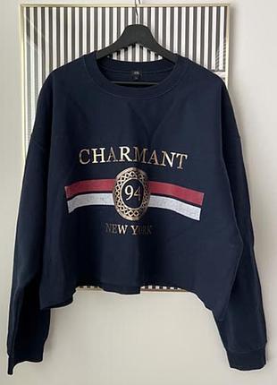 Укорочений темно-синій світшот від бренду river island з написом «charmant 94 new york»