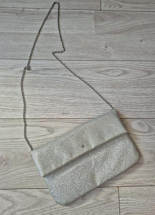 Сріблястий блискучий клатч-конверт accessorize
