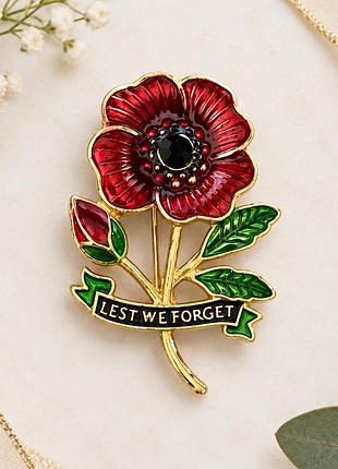 Елегантна брошка червоний мак із написом lest we forget та кристалом
