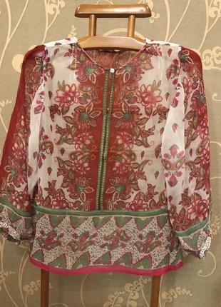 Очень красивая и стильная брендовая блузка в цветах..100% вискоза.1 фото