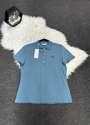 Бірюзове жіноче поло приталеного крою бренду lacoste (модель серії l.12.d slim fit).
