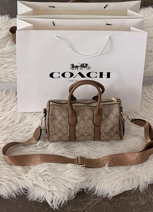 Сумка coach compass bag 25 crossbody in signature бежевий є