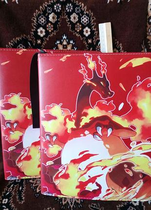 450 карточок альбом (класер) для коллекционных карточек pokémon чаризарда (charizard) в окружении пламени. покемон карточки з європи