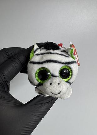 М'яку іграшку серії ty teeny tys — зебру на ім'я zilla (або схожу невелику плюшеву іграшку цієї ж серії з фірмовою червоною биркою ty