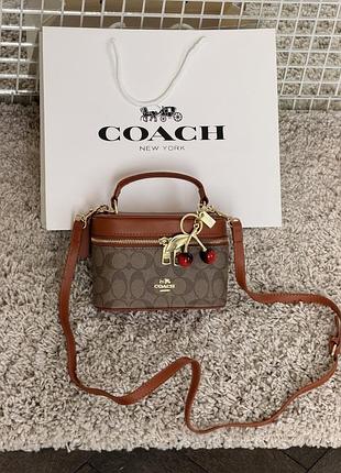 Сумка coach rainer crossbody bag 18 in signature canvas карамельный есть