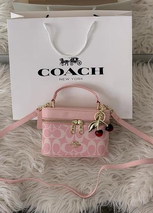 Сумка coach rainer crossbody bag 18 in signature canvas рожевий є