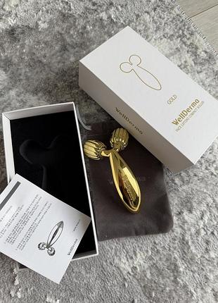 Роликовий масажер для догляду за обличчям wellderma gold roller