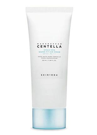 Skin1004 madagascar centella hyalu-cica water-fit sun serum uv spf 50+ pa++++ 100 ml увлажняющая солнцезащитная сыворотка для лица