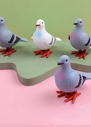Заводная игрушка голубь