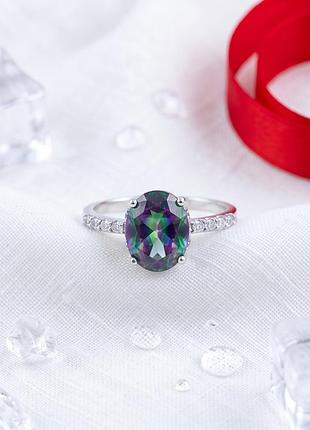 Серебряная кольца lover с овальным мистическим топазом и фианитами (1734339)