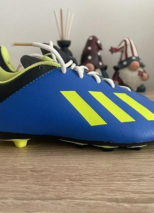 Детские футбольные бутсы adidas x 18.4 fxg