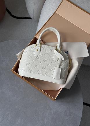 Сумка alma monogram empreinte leather cream