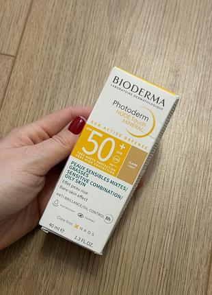 Сонцезахисний тональний крем-флюїд bioderma photoderm nude touch spf 50+