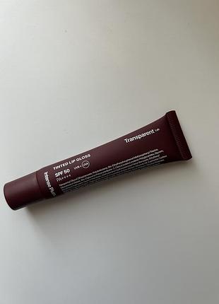 Блиск для губ transparent tinted lip gloss spf 50